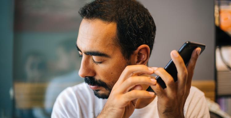 Blind man uses screen reader on phone 