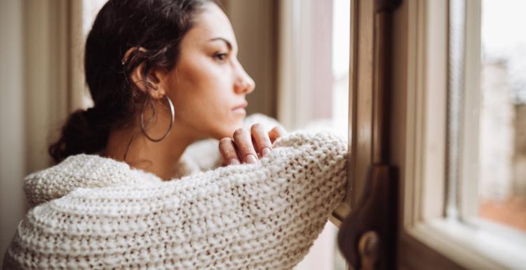 woman looking out of window